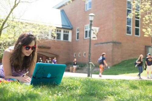 Female Student Studying Outside on the Lawn